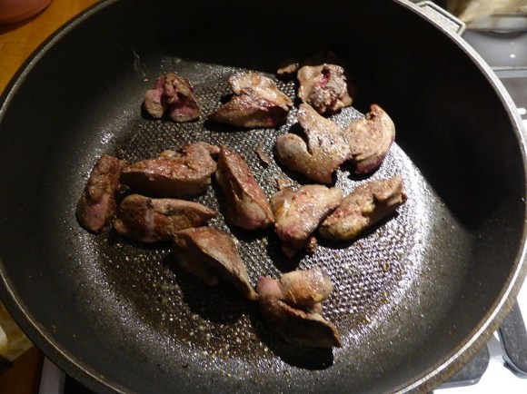 meat cooking in a pan